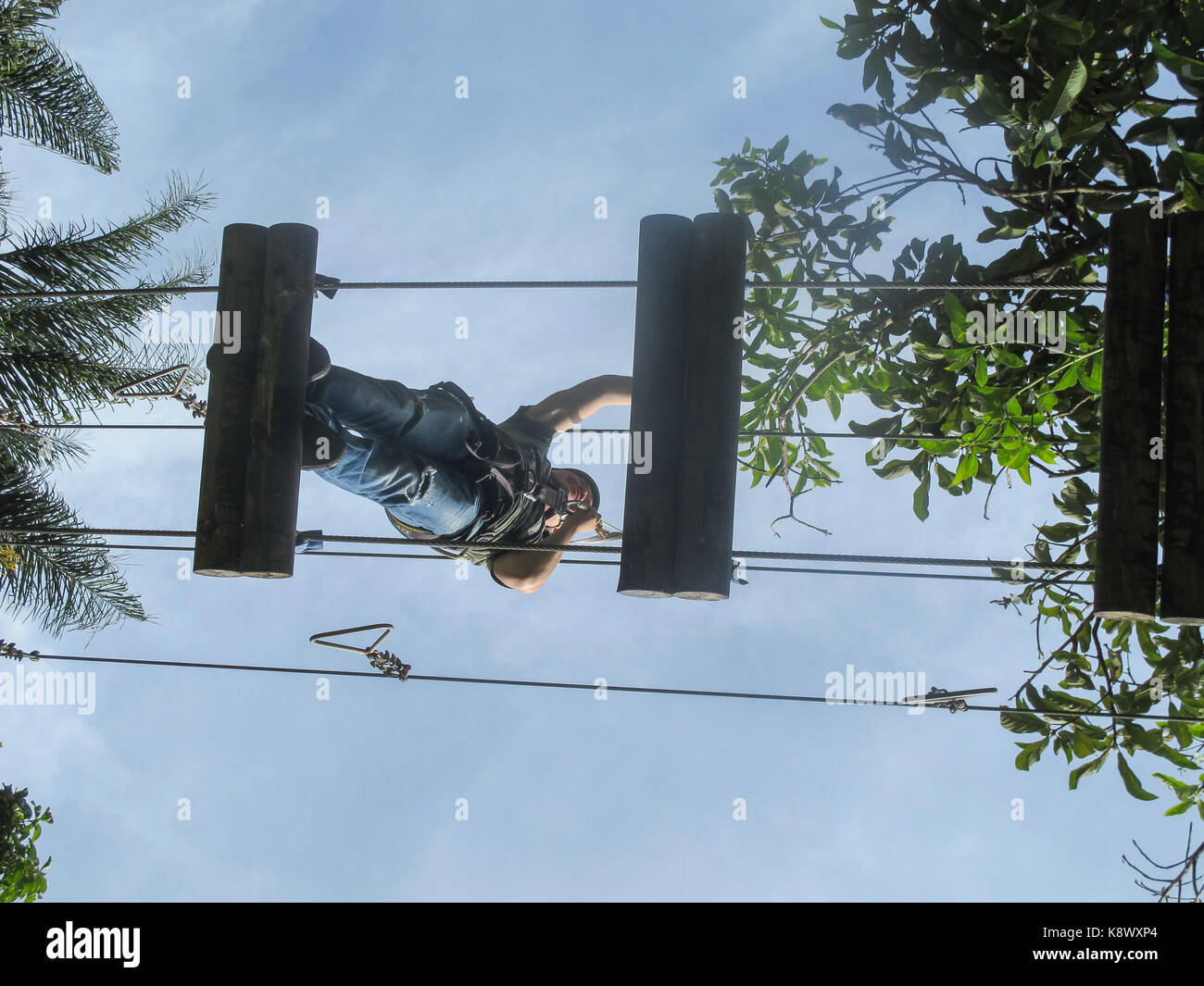 A girl climbing 12 feet over ground in El Salado Ecological Park Stock Photo