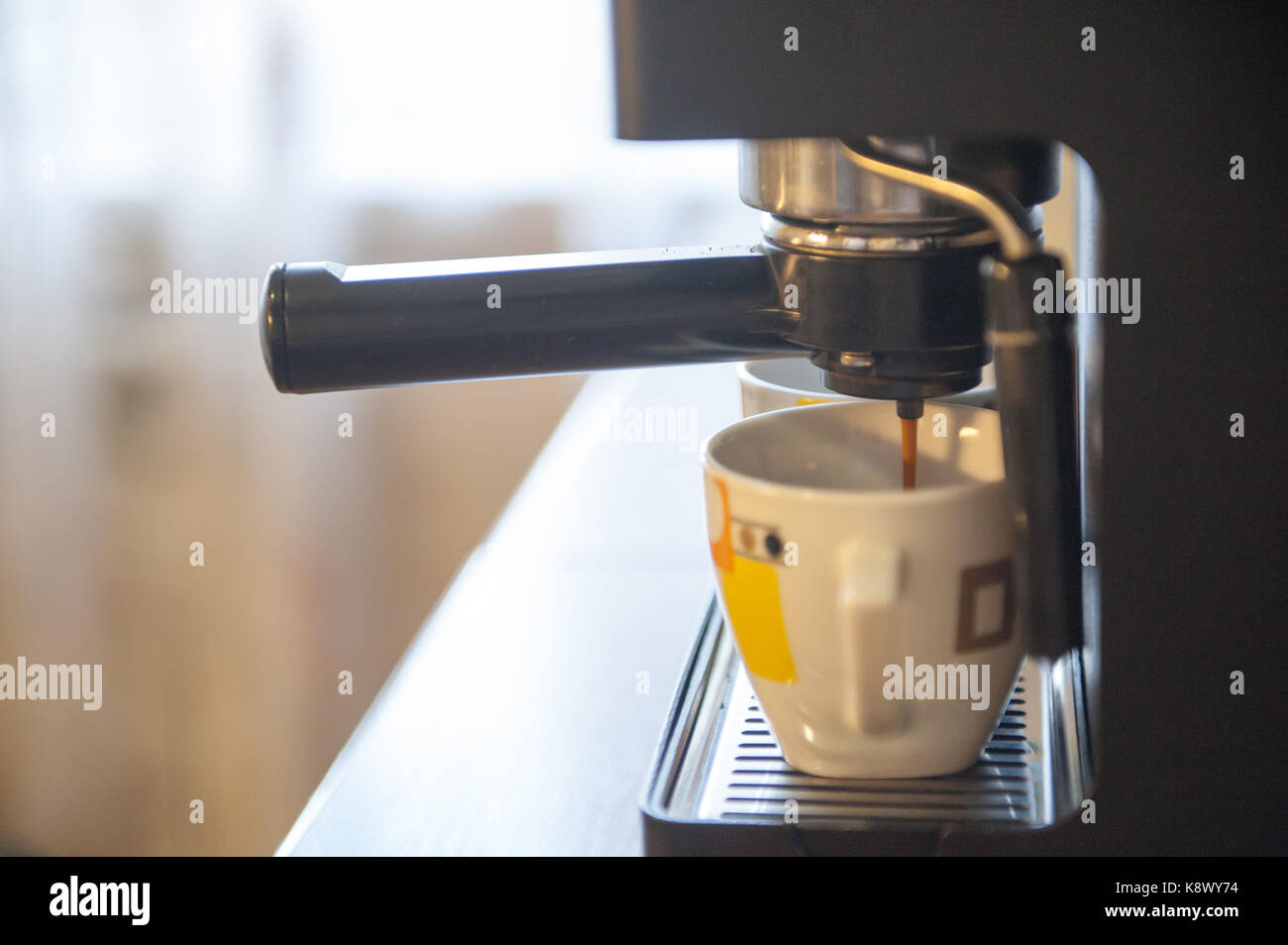 Coffee making using espresso machine at home Stock Photo Alamy