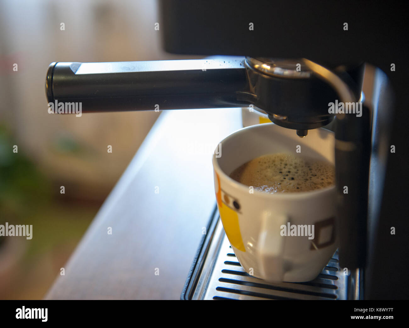 Coffee making using espresso machine at home Stock Photo Alamy