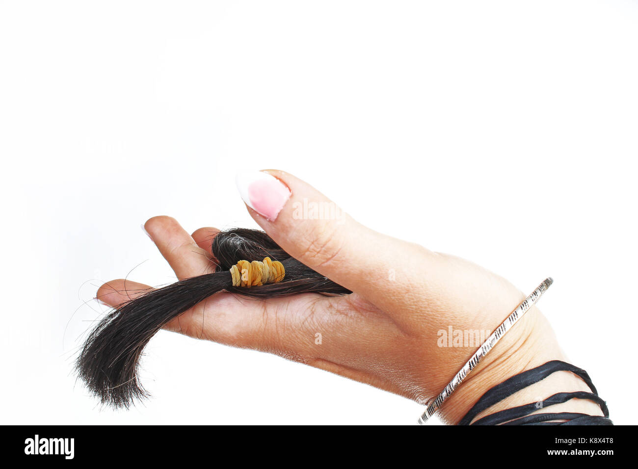 Cutted hair tail for hair extension. Stock Photo
