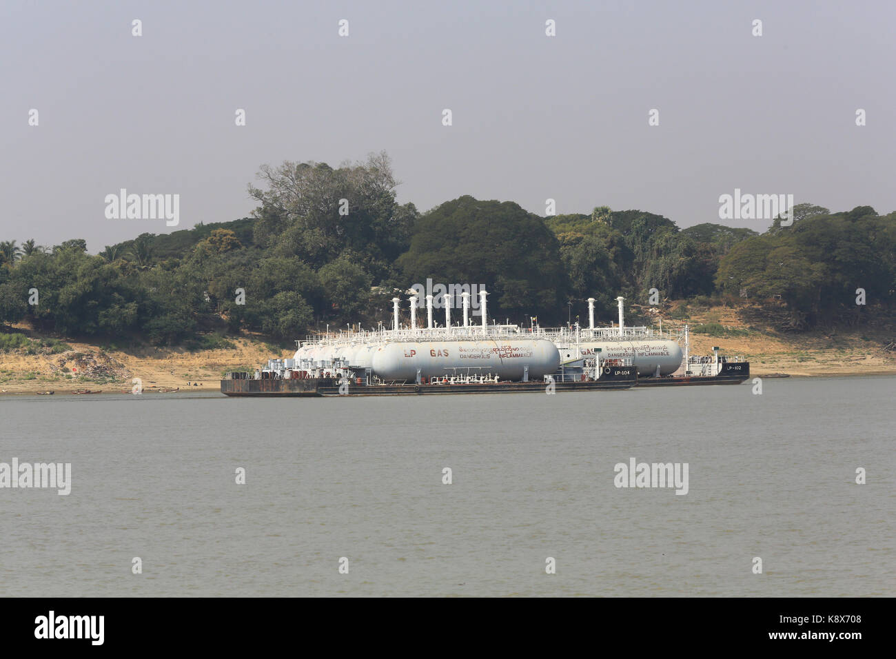 Two LP Gas barges moored to the banks of the Irrawaddy River in Myanmar (Burma). Stock Photo