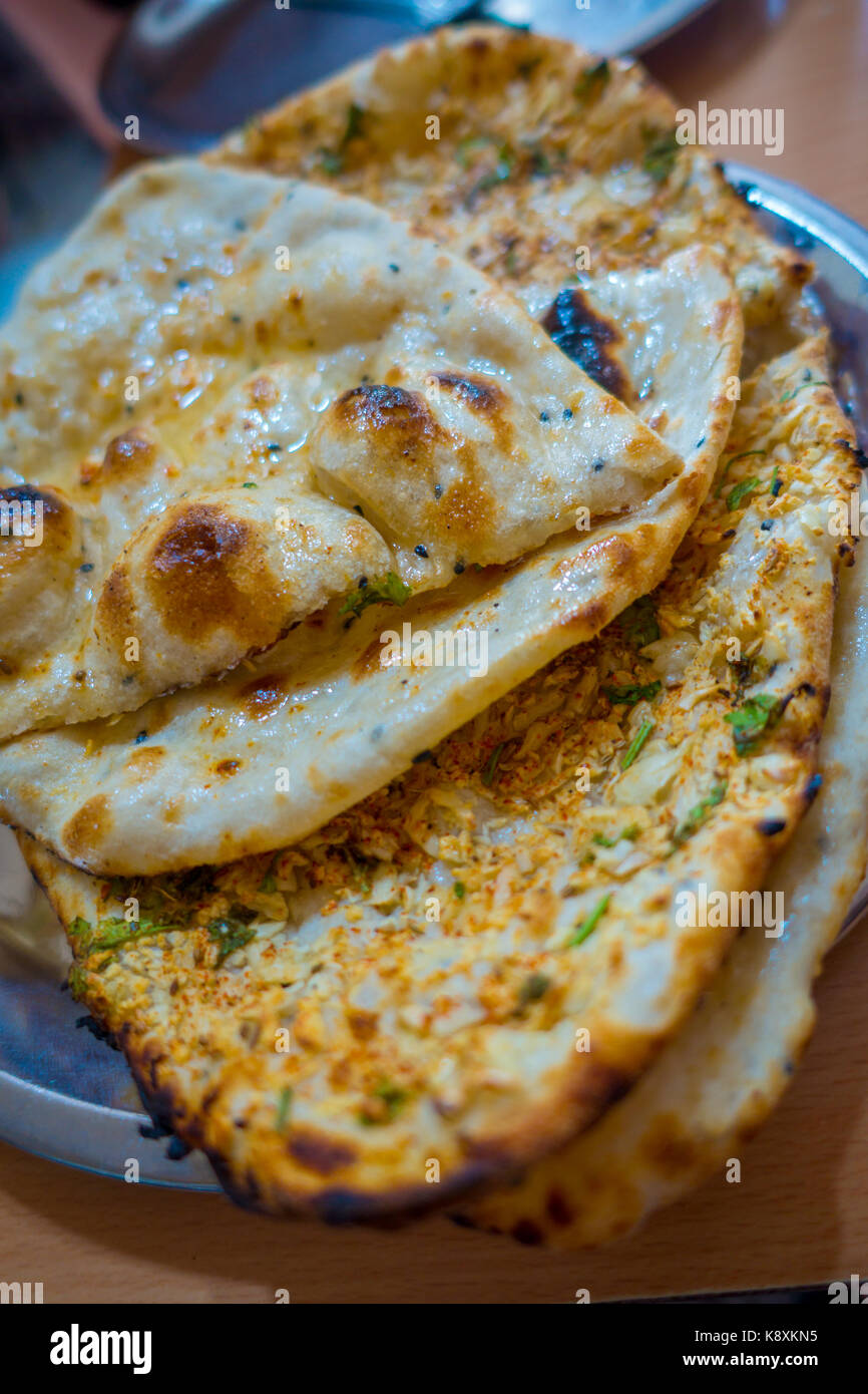 Many homemade small tortillas for breakfast, in silver foil, Jaipur city in India Stock Photo
