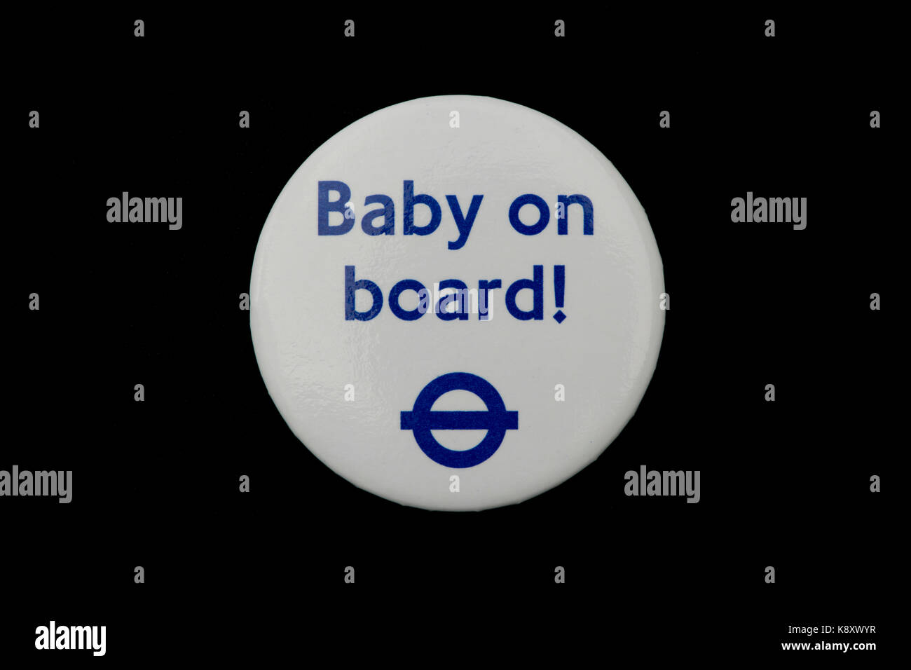 A London Underground Baby on Board badge worn on a black fabric garment (Editorial use only). Stock Photo