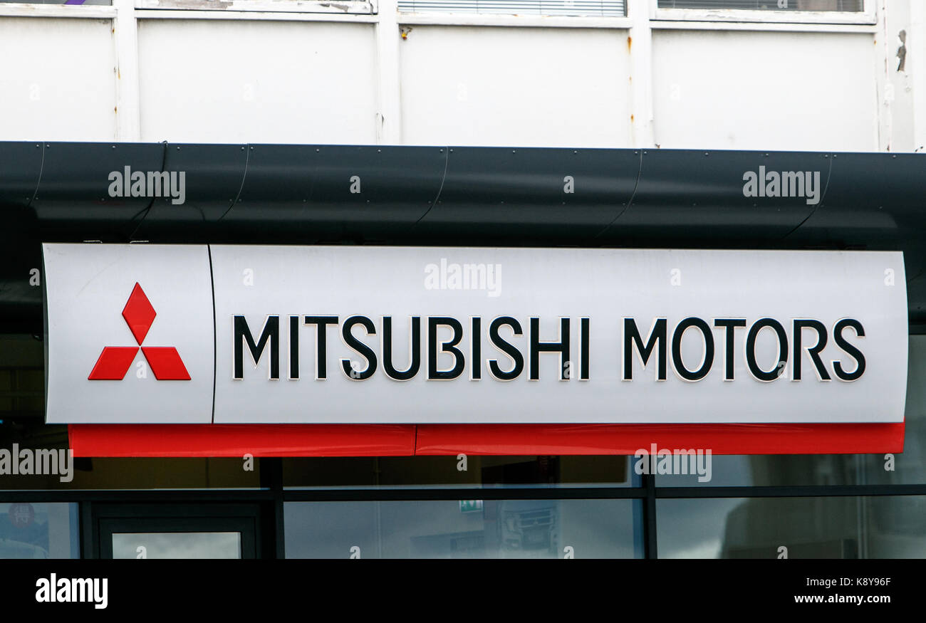Mitsubishi Motors sign is attached to the exterior of their car dealership in Reykjavik. Stock Photo