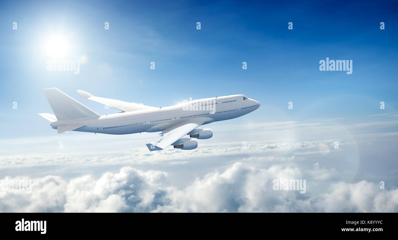 Airplane flying above clouds Stock Photo - Alamy