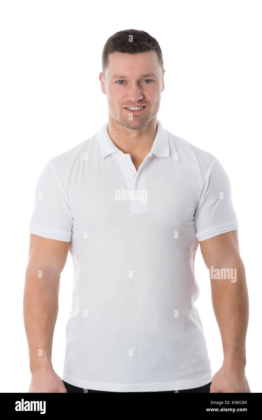 Portrait of confident man in casuals standing against white background ...