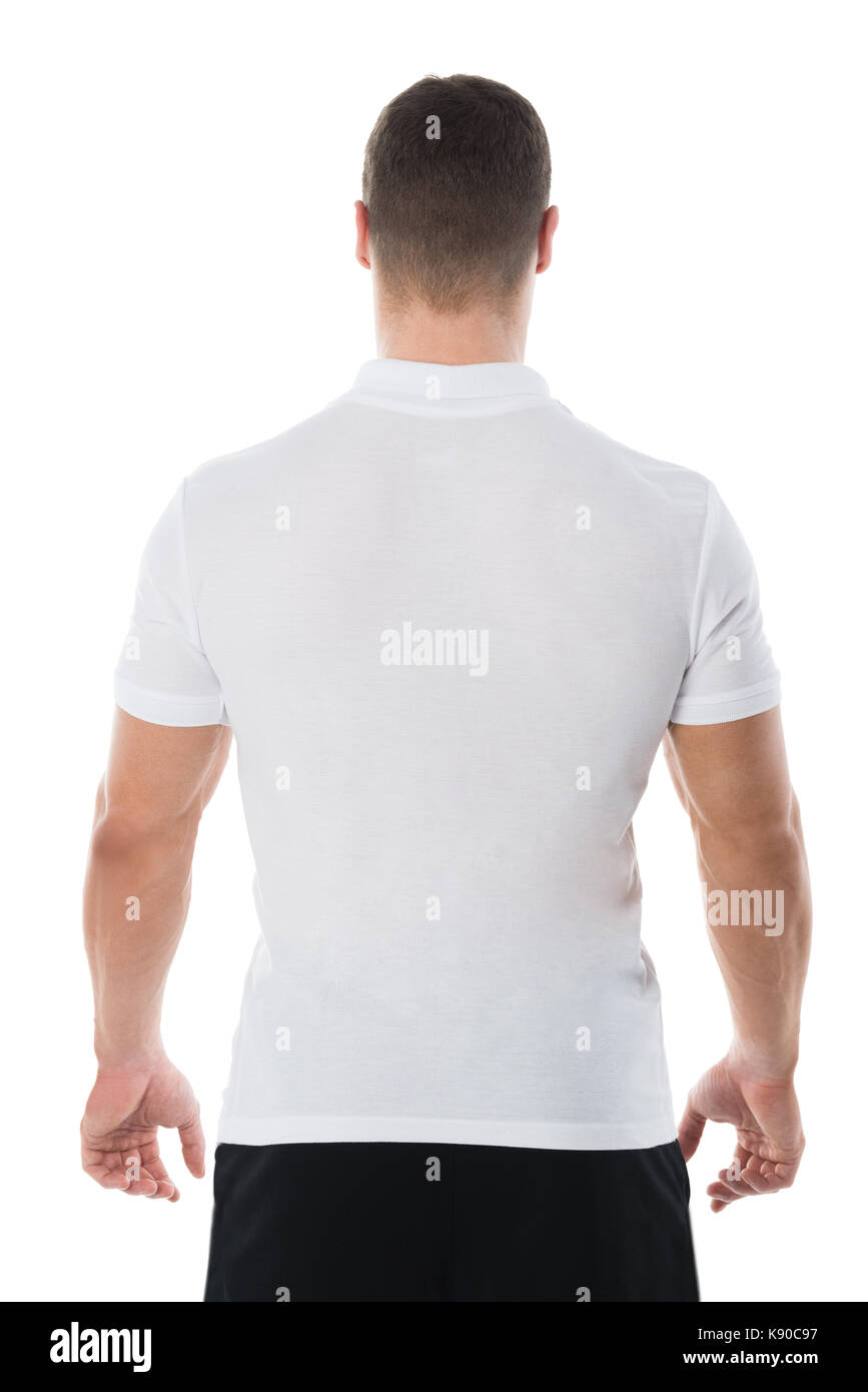 Rear view of man in casuals standing against white background Stock ...