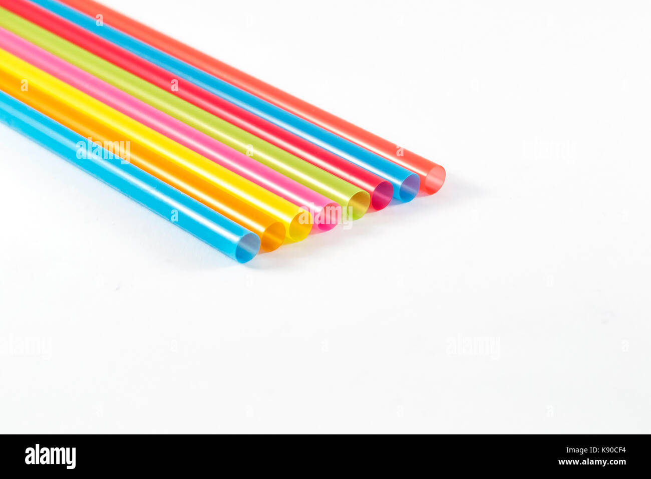 Colorful drinking straws on white background Stock Photo - Alamy
