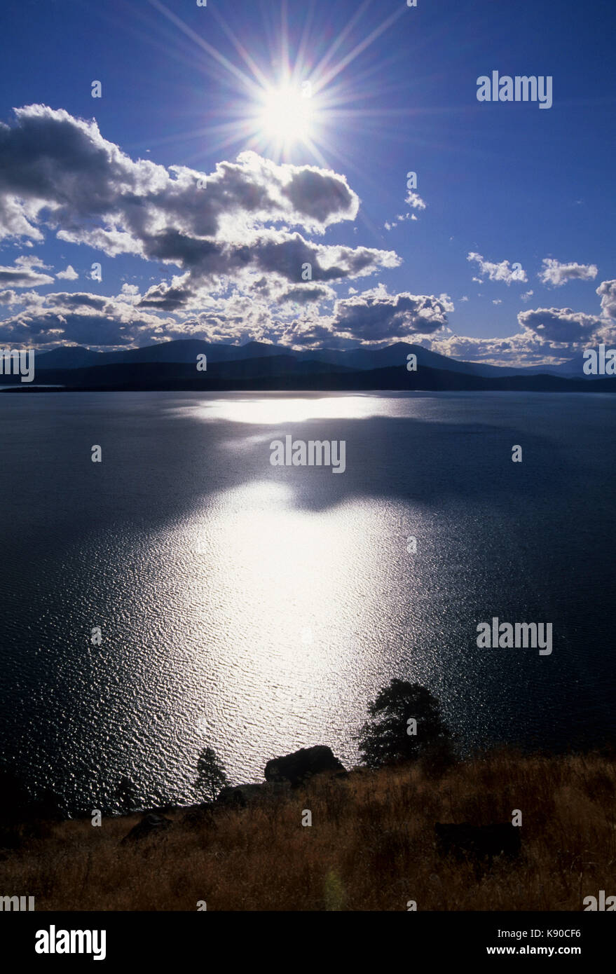 Upper Klamath Lake silhouette from Modoc Rim with starburst, Winema ...