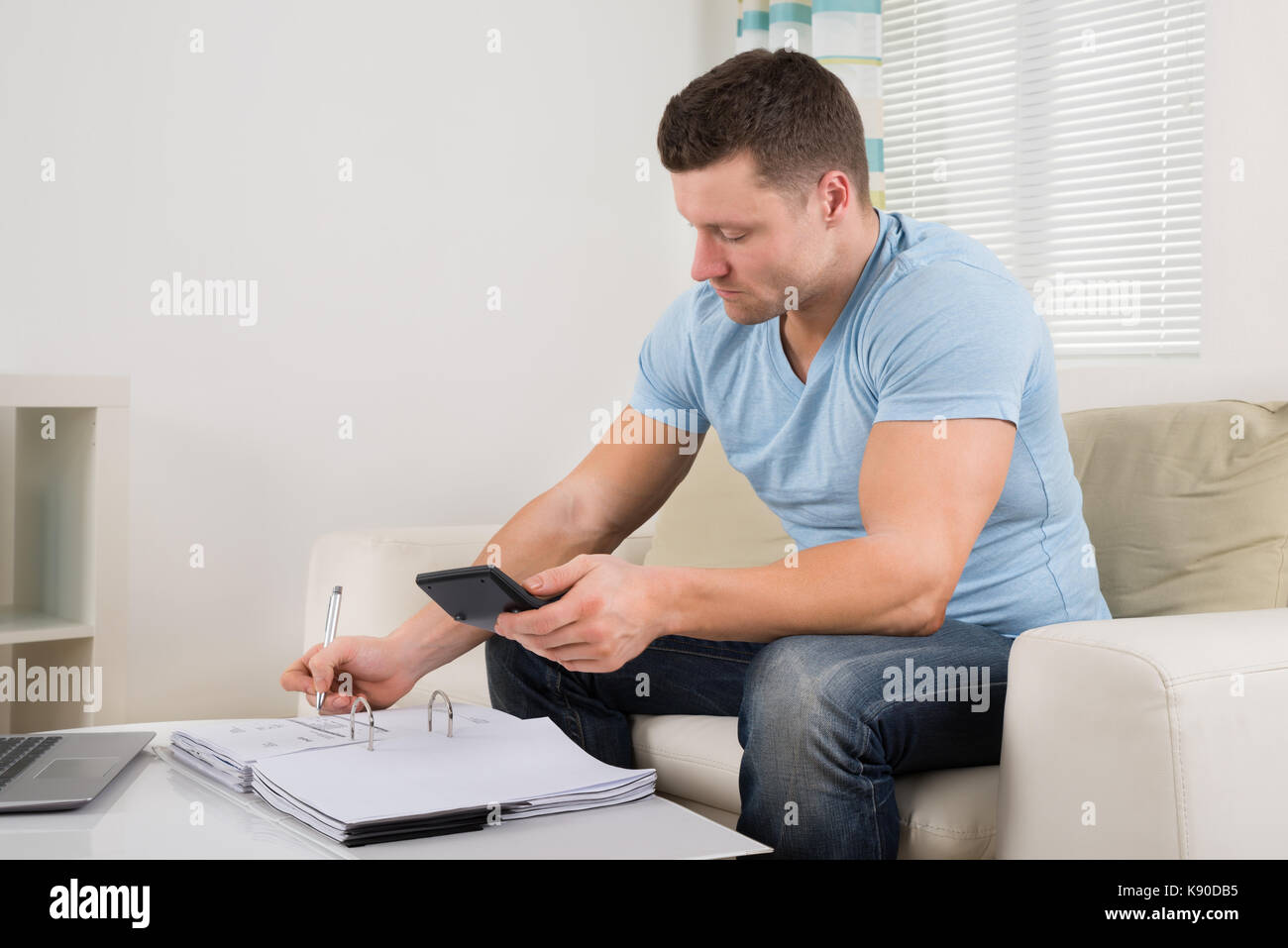 Mid adult man writing hi-res stock photography and images - Alamy