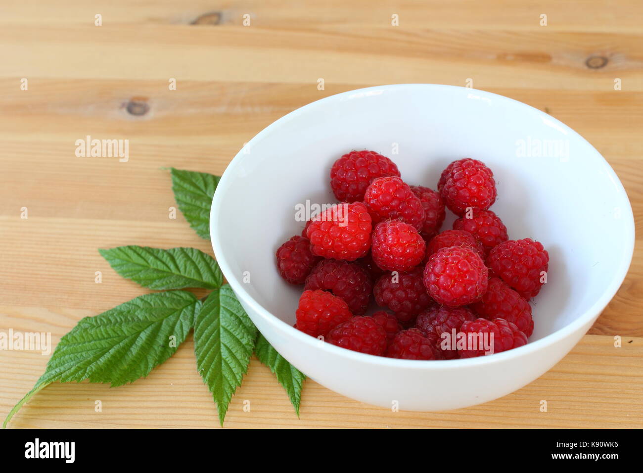 Small Rasperry Fruit fresh red raspberry fruits in a small white bowl Stock Photo - Alamy