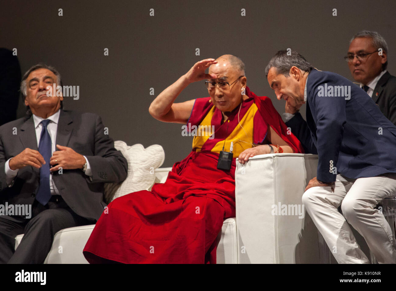 The XIV Dalai Lama takes to the stage to address the faithful in Palermo on September 18, 2017. Stock Photo