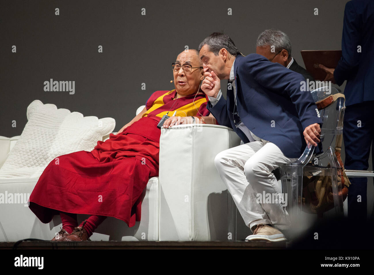 The XIV Dalai Lama takes to the stage to address the faithful in Palermo on September 18, 2017. Stock Photo