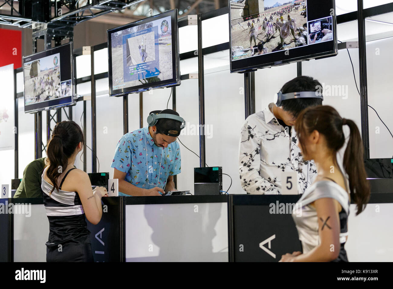 Chiba, Japan. 21st Sep, 2017. Visitors test the latest technology innovations in video game devices and platforms during the Tokyo Game Show (TGS 2017) on September 21, 2017, Chiba, Japan. This year's event hosts 609 companies from 36 different countries, introducing 1,317 video game titles for smartphones, games consoles, VR, AR and MR platforms. The show, which expects to attract 250,000 visitors, runs until September 24 at the International Convention Complex Makuhari Messe in Chiba; and will be streamed live around the world. Credit: Rodrigo Reyes Marin/AFLO/Alamy Live News Stock Photo