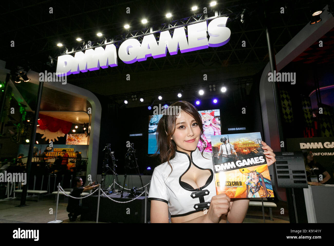 Chiba, Japan. 21st Sep, 2017. A booth assistant poses for a photograph during the Tokyo Game Show (TGS 2017) on September 21, 2017, Chiba, Japan. This year's event hosts 609 companies from 36 different countries, introducing 1,317 video game titles for smartphones, games consoles, VR, AR and MR platforms. The show, which expects to attract 250,000 visitors, runs until September 24 at the International Convention Complex Makuhari Messe in Chiba; and will be streamed live around the world. Credit: Rodrigo Reyes Marin/AFLO/Alamy Live News Stock Photo