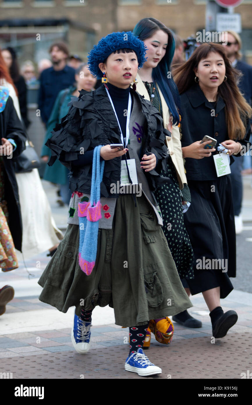 Street Style from Day three of London Fashion Week, Spring Summer 2018, on  Sunday September 17th 2017. Image shows Tahi Kim wearing a Victorian  inspired top by Comme Des Garcons, Converse strainers