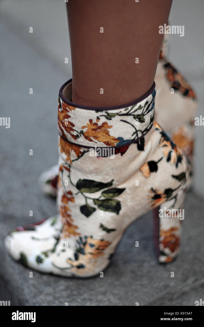 Street Style from Day three of London Fashion Week, Spring Summer 2018, on  Sunday September 17th 2017. Image shows a pair of velvet floral print ankle  boots by Christian Louboutin Stock Photo - Alamy