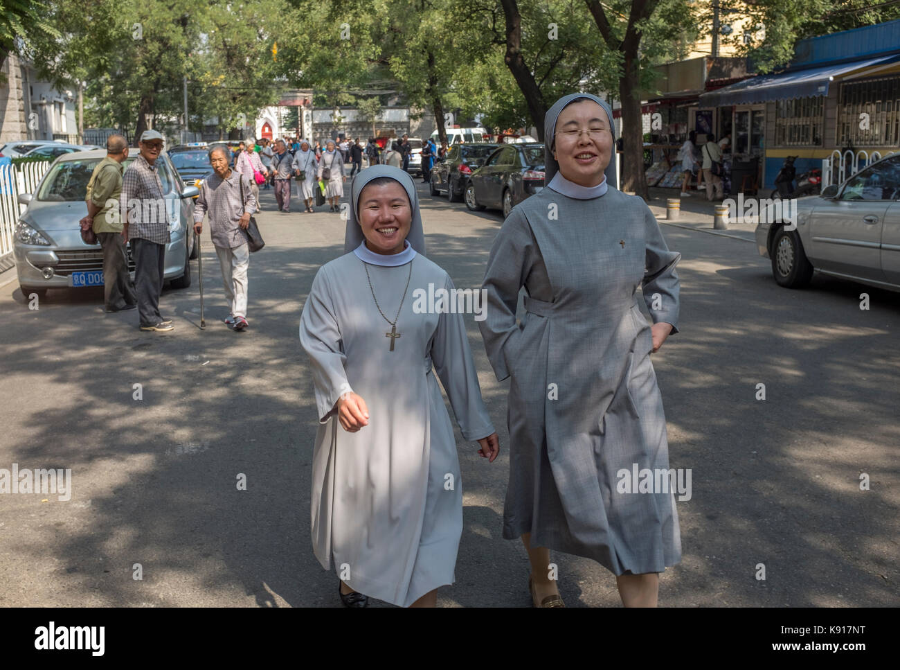 Beijing, China. 21st Sep, 2017. Chinese nuns leave after attending a mass to celebrate the tenth anniversary of the ordination of Joseph Li Shan as archbishop of Beijing on 21 September, 2017 at Xishiku Church, an officially-sanctioned Catholic church in Beijing, China. The Vatican's efforts to heal a decades-long rift with China appear to have stalled, with each side still unwilling to accept controversial bishops appointed by the other. heir Credit: Lou Linwei/Alamy Live News Stock Photo