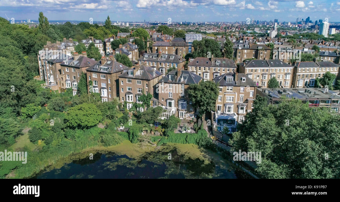Aerial view of Victorian houses with the skyline of the City of London