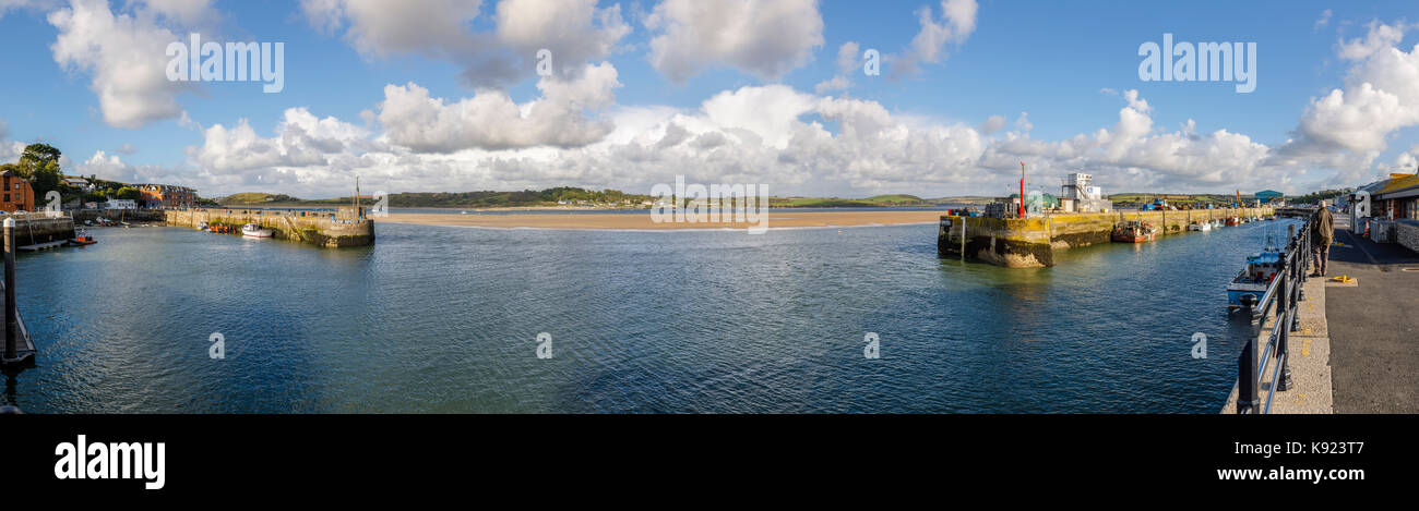 Entrance to the harbour at Padstow, a fishing village on the River Camel estuary west bank, and view of Rock, north coast of Cornwall, England Stock Photo