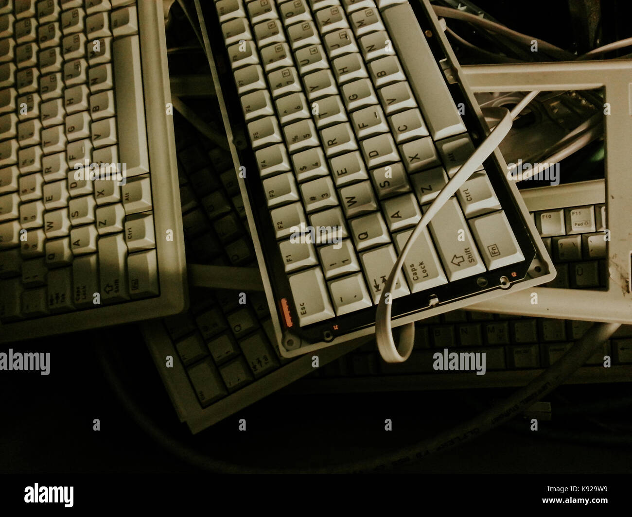 Broken keyboard inside electronic parts junk bin Stock Photo Alamy