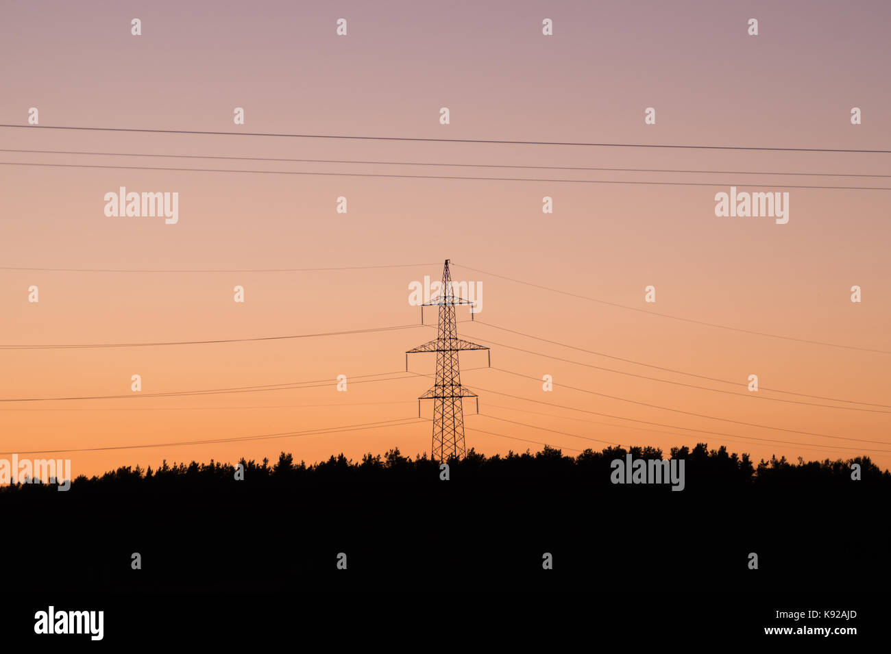 High voltage tower with silhouette sky sunset background Stock Photo ...
