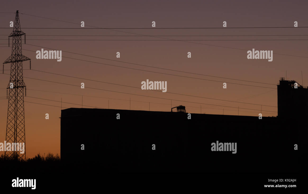 High voltage tower with silhouette sky sunset background Stock Photo ...