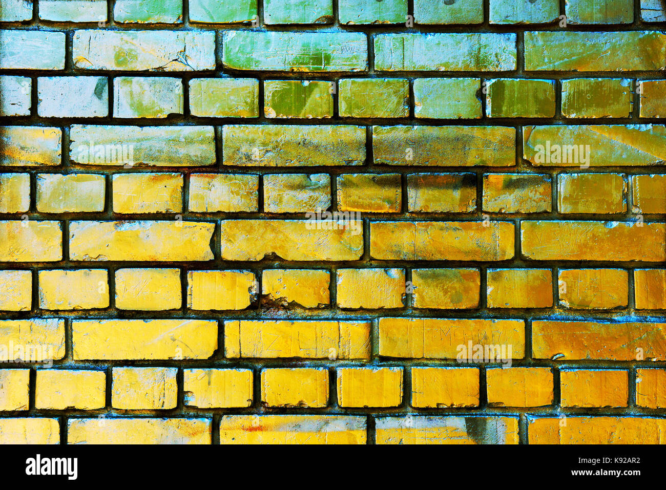 Gold yellow brick wall texture with scratched grungy surface Stock Photo