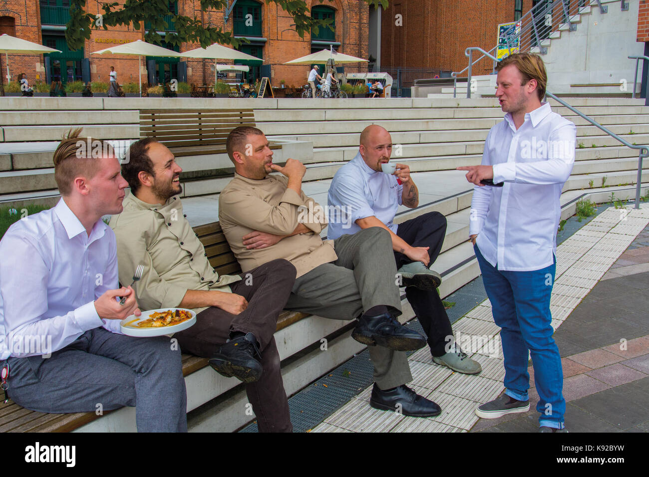 German Michelin stars Chef Kevin Fehling, La Table, Hamburg, talking to colleques during their break Stock Photo
