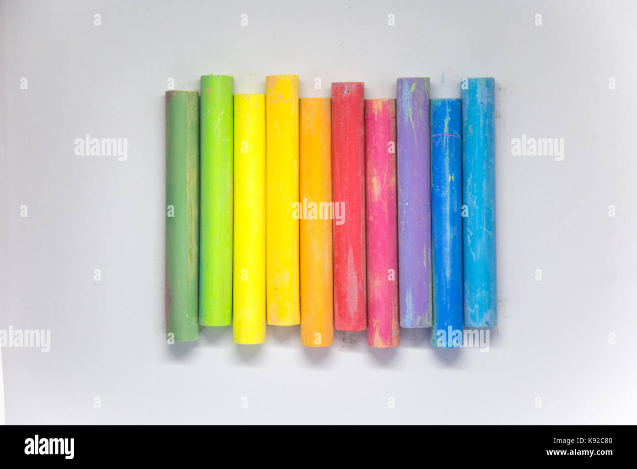 Vivid Colorful Chalk Sticks On A White Paper. Beautiful School Supplies 