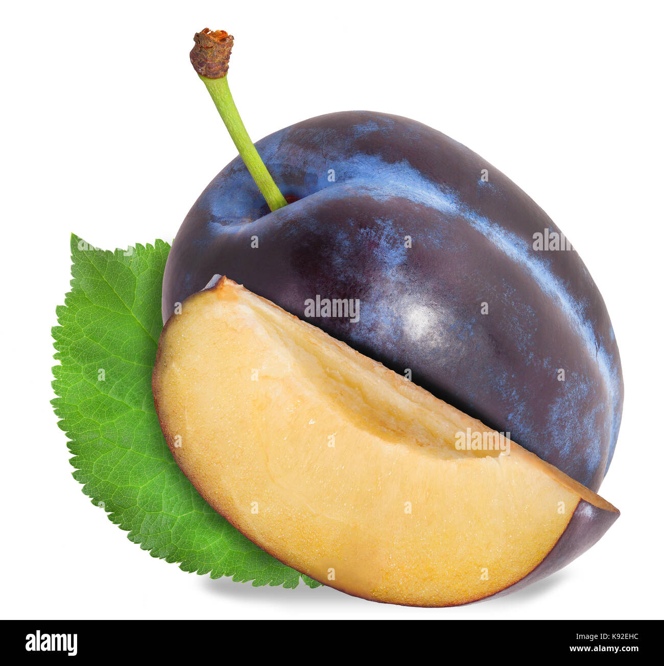 Plum and half of fruit on a white. File contains clipping paths. Stock Photo