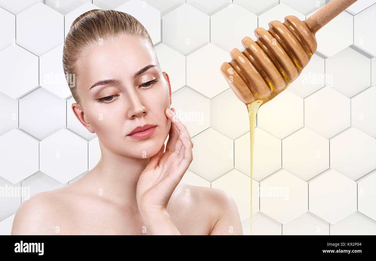 Young woman prepare for honey facial mask. Stock Photo