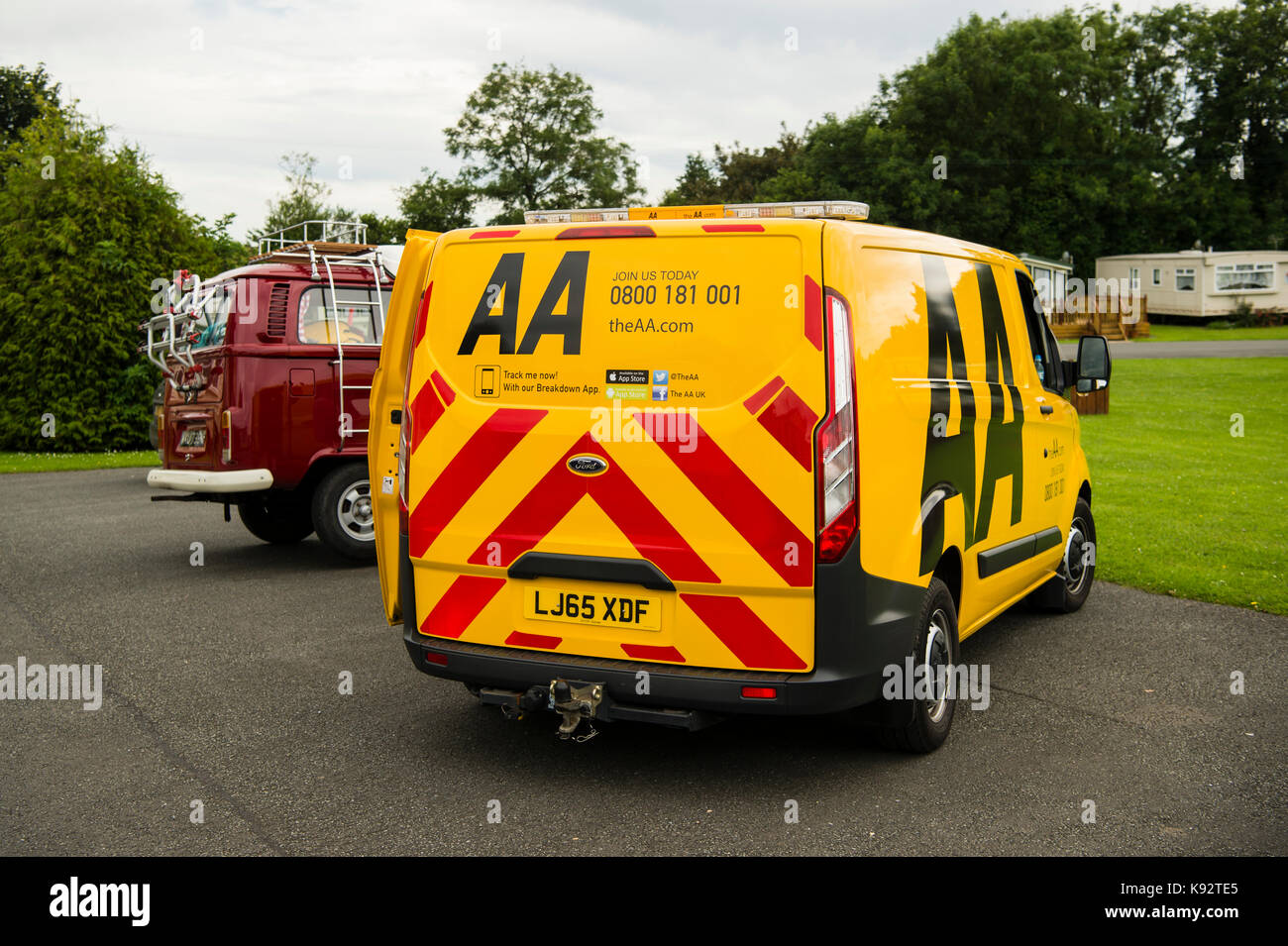 Roadside repairs An AA (Automobile Association) repair man working to