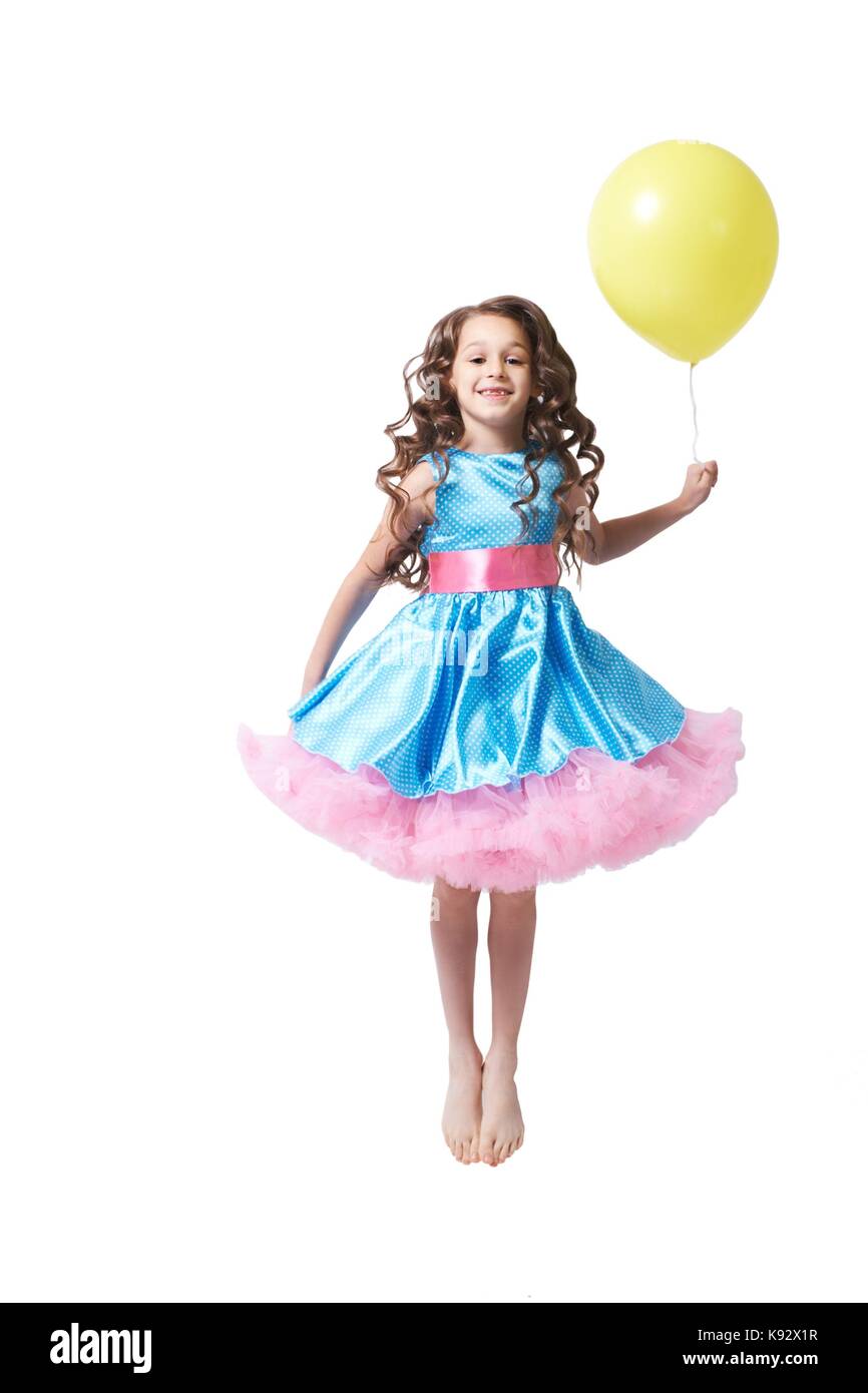 Portrait. Girl. smile child. Blue dress. Balloon. Stock Photo