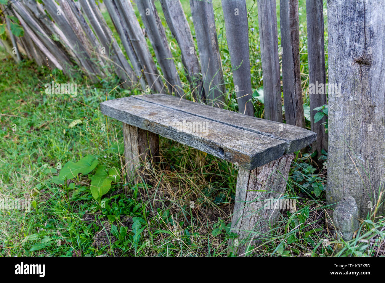 Old wooden bench in the village Stock Photo - Alamy