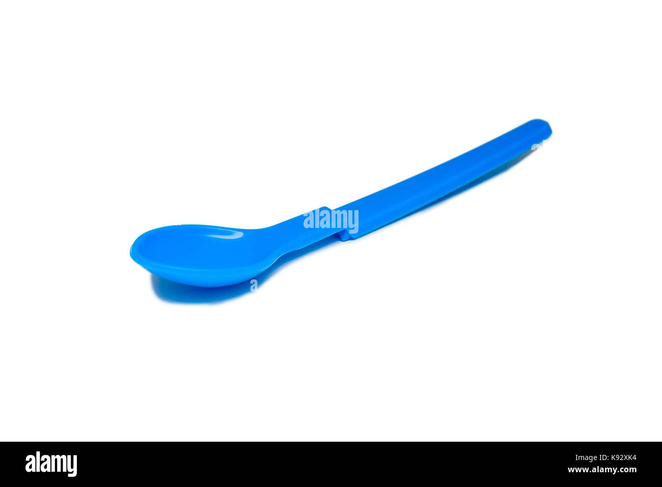 Bright blue plastic baby spoon isolated Stock Photo Alamy