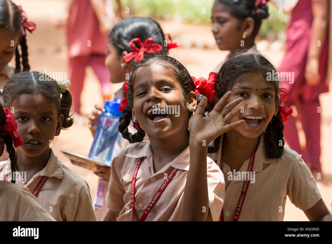 PONDICHERY, PUDUCHERY, INDIA - SEPTEMBER 04, 2017. Unidentified boys girls children get in lines with their plates to clean it before lunch at the out Stock Photo