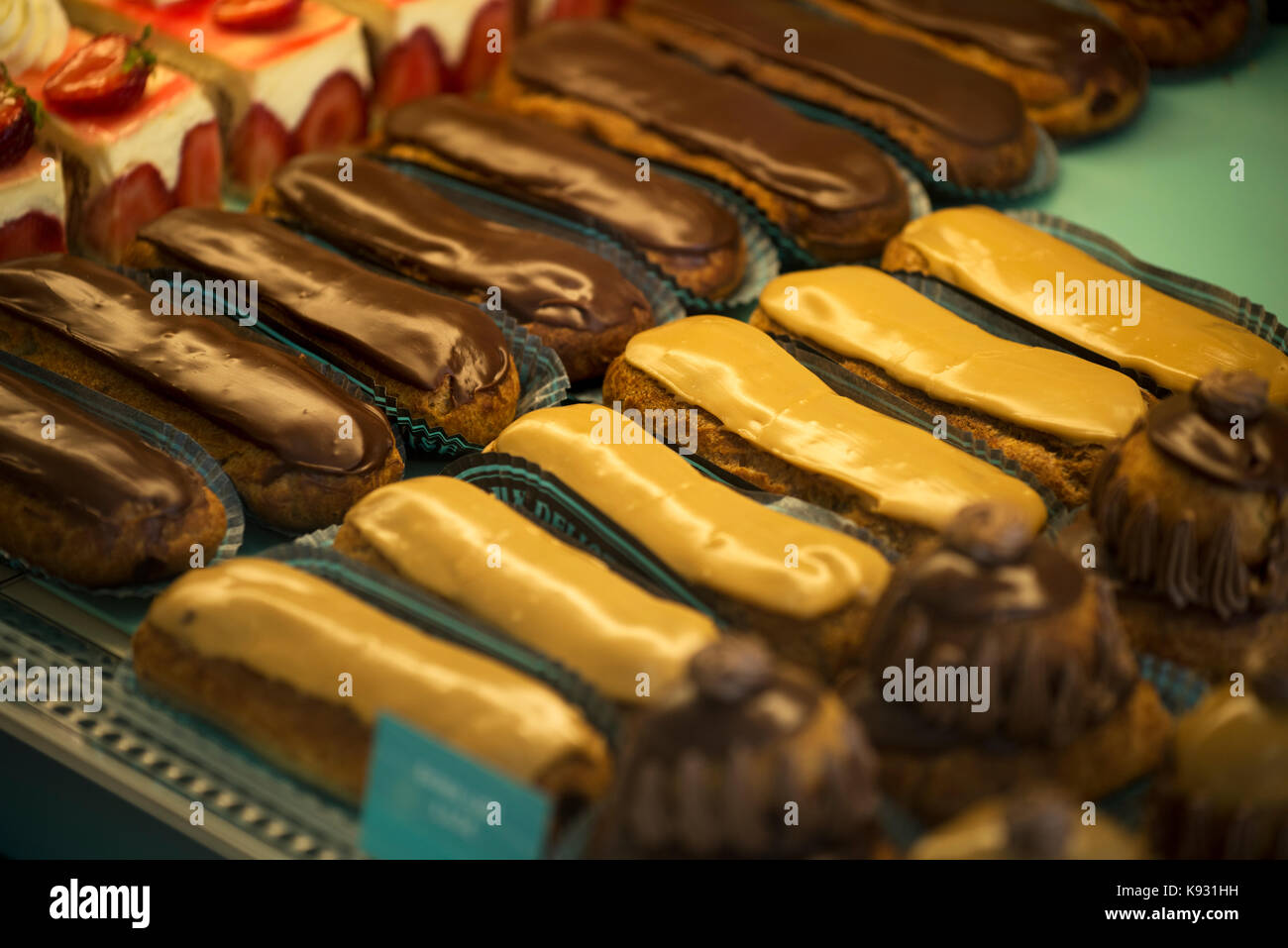 Eclair cakes in a patisserie in Falaise,Calvados, Normandy, France. Aug 2017 Stock Photo