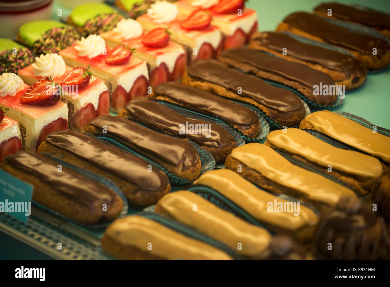 Eclair cakes in a patisserie in Falaise,Calvados, Normandy, France. Aug 2017 Stock Photo