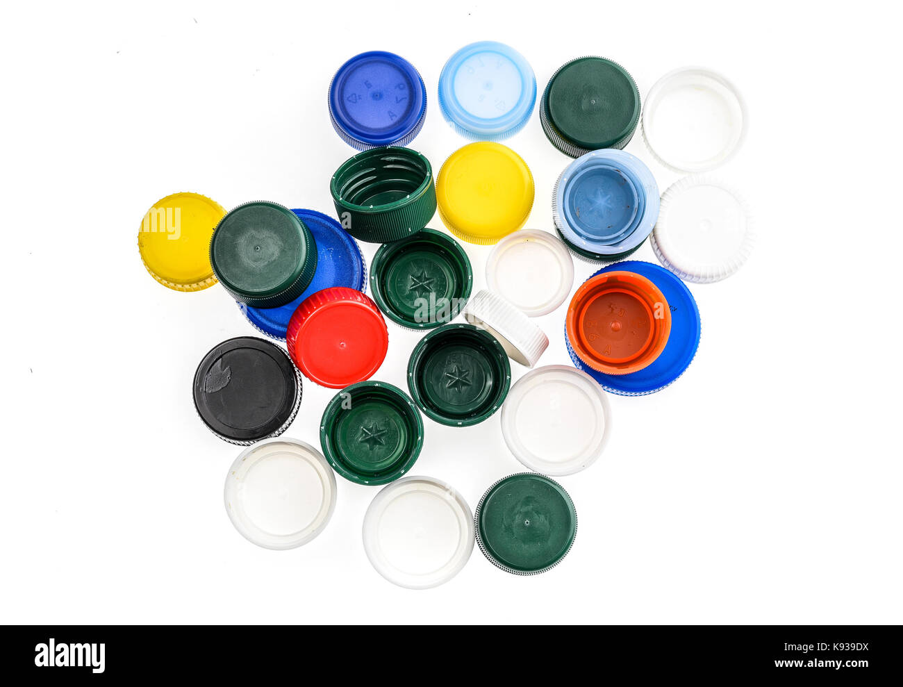 Plastic bottle caps in different colours. A pile of plastic bottle