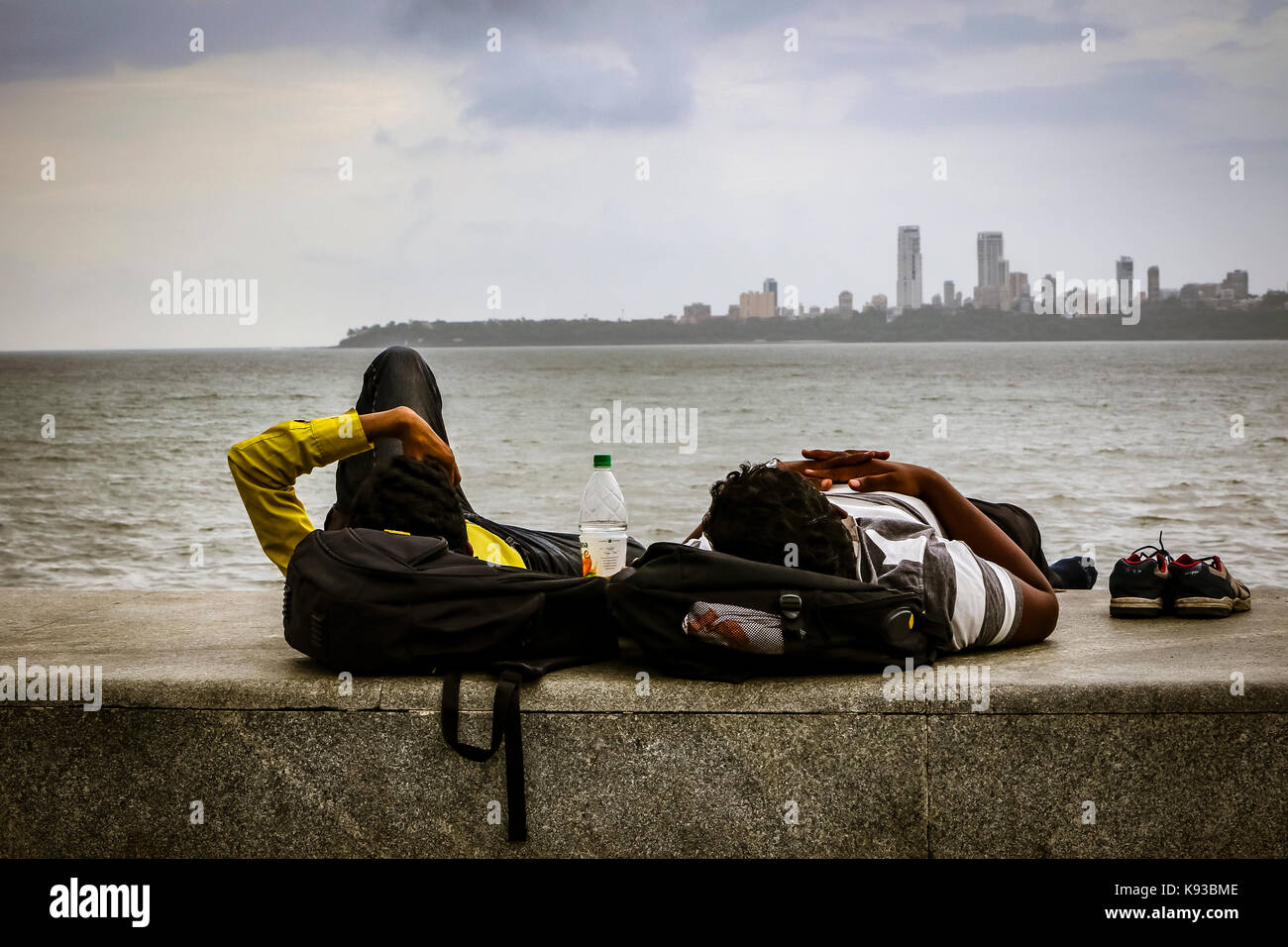 Resting pals of marine drive in Mumbai, India Stock Photo