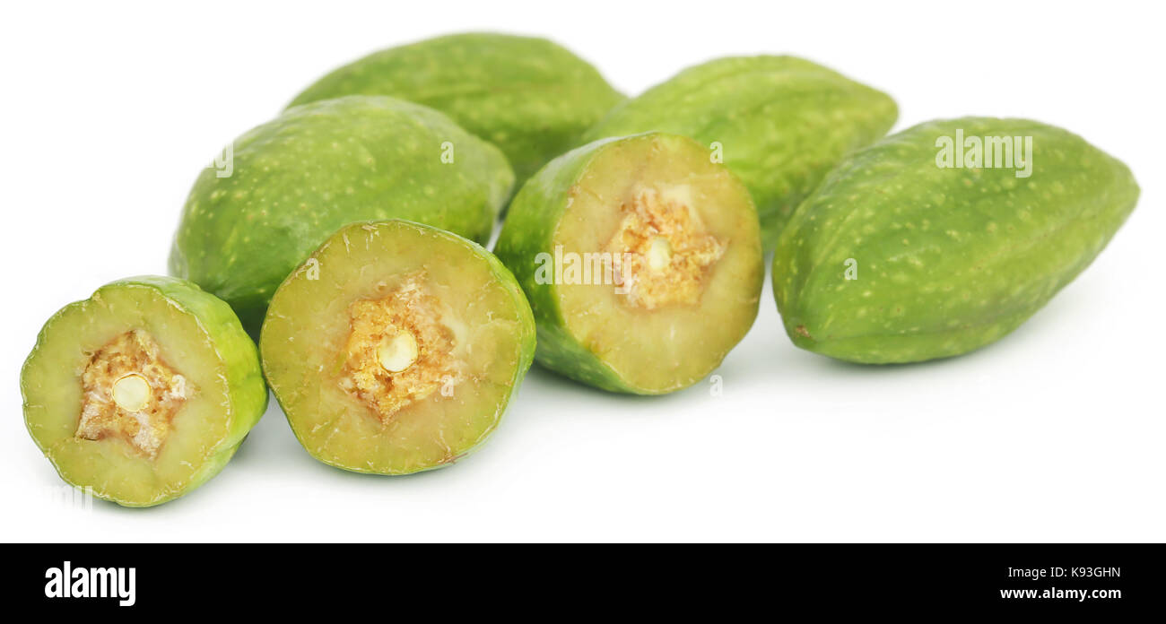Fresh green medicinal haritaki fruits  over white background Stock Photo