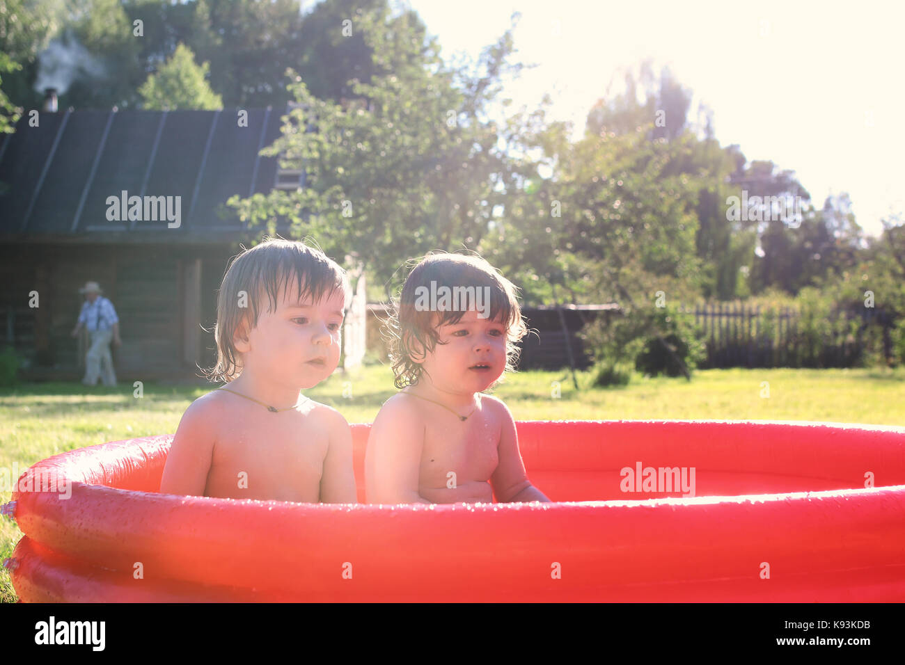 child splashing in the bath outdoors Stock Photo Alamy
