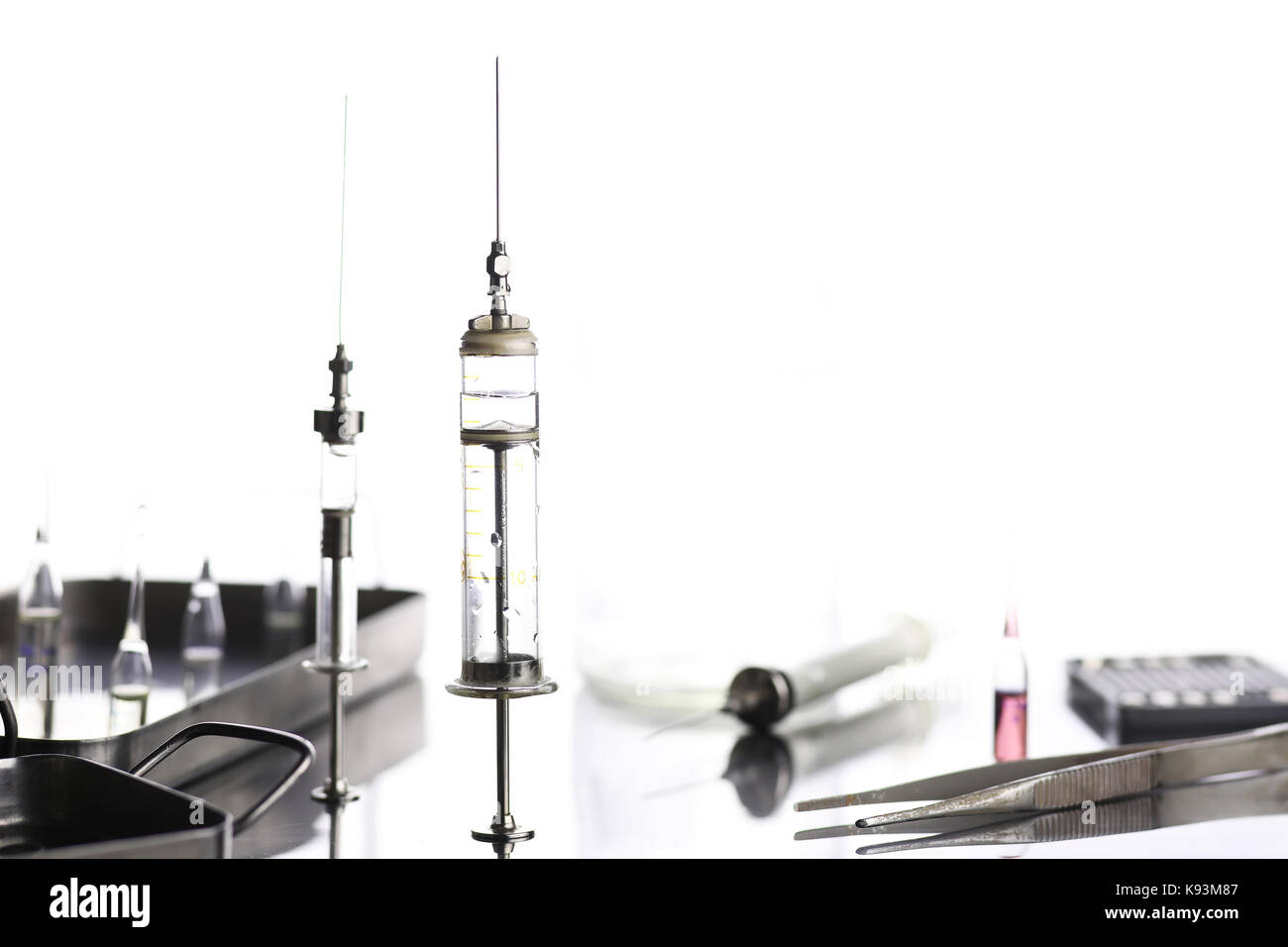 Old metal medical syringe and accessories on the table Stock Photo Alamy