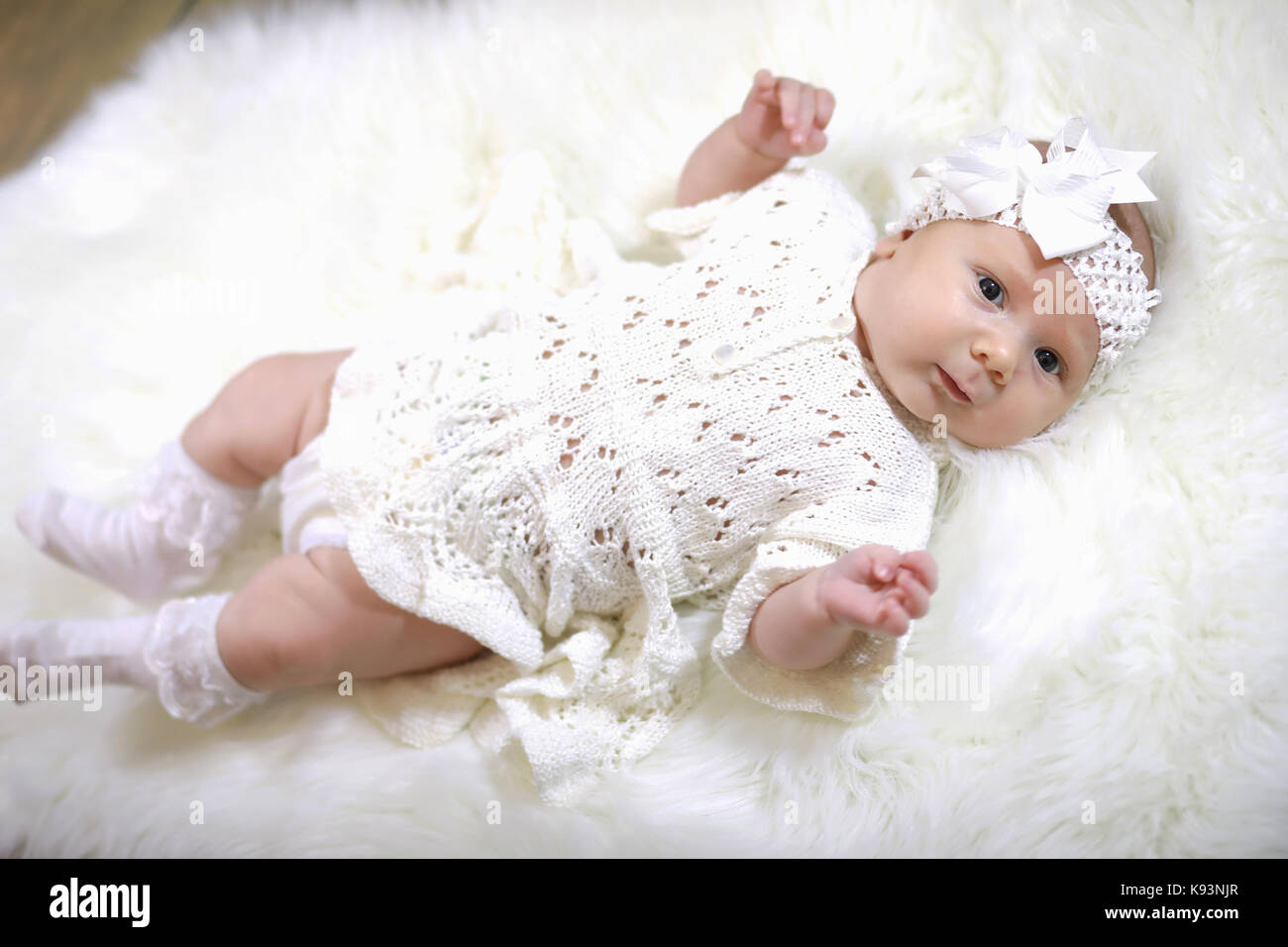 portrait of a beautiful baby girl in a white dress Stock Photo - Alamy