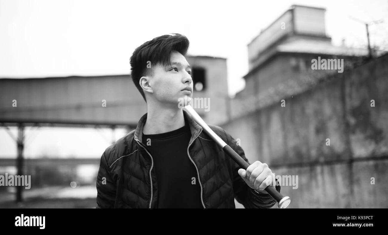 Black White photo of Asian young man outdoors posing Stock Photo - Alamy