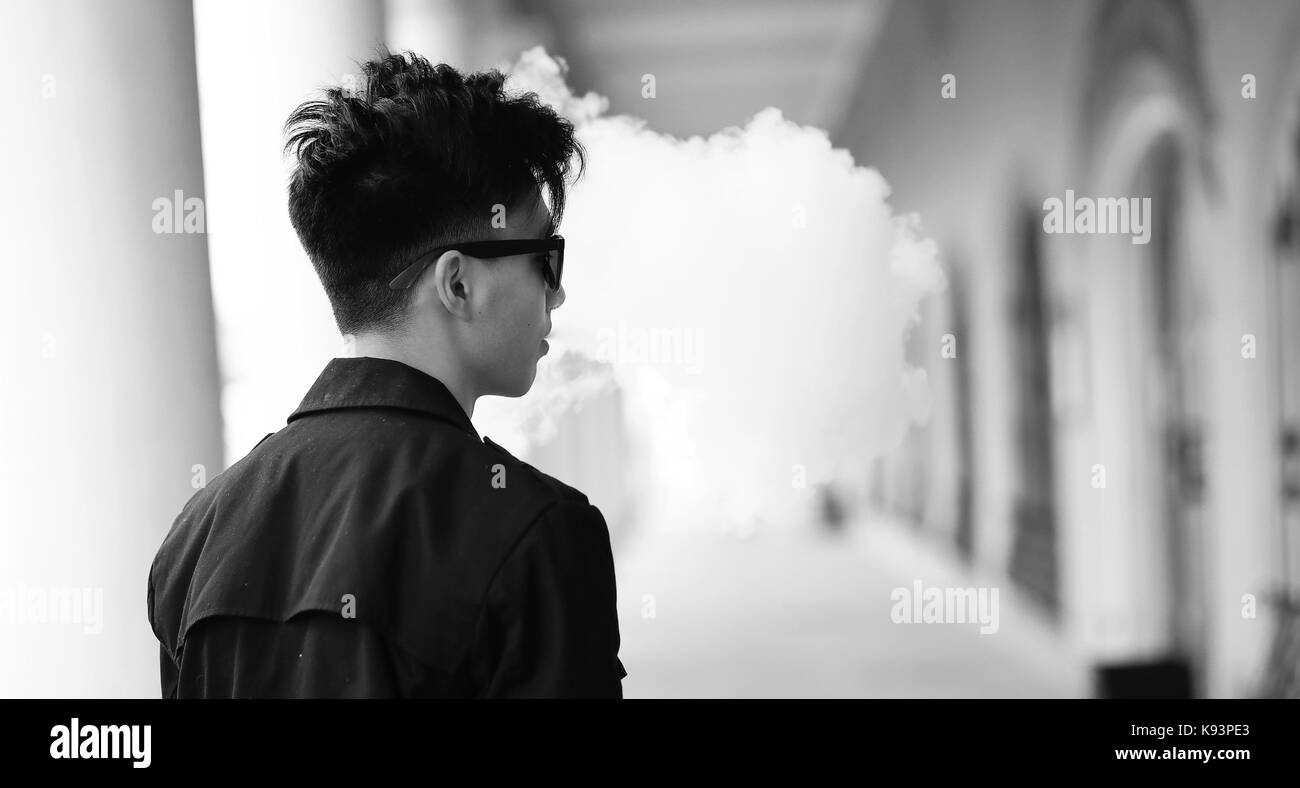 Black White photo of Asian young man outdoors posing Stock Photo - Alamy