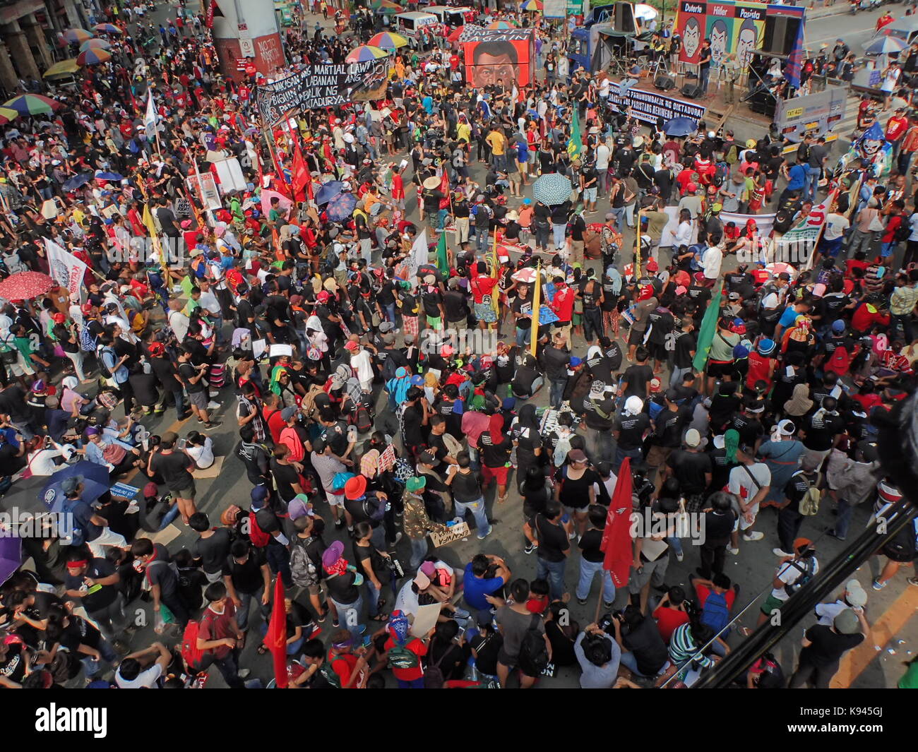 Manila, Philippines. 21st Sep, 2017. Thousand of militant group, activist, indigenous people, victims and families of drug related killings and victims of Marcoses' dictatorship converge at Mendiola in Manila during the 45th commemoration of the terrors of 1972 Martial Law. They burned a Rubik's cube with images of Pres. Duterte, Hitler and a dog. Credit: Sherbien Dacalanio/Pacific Press/Alamy Live News Stock Photo