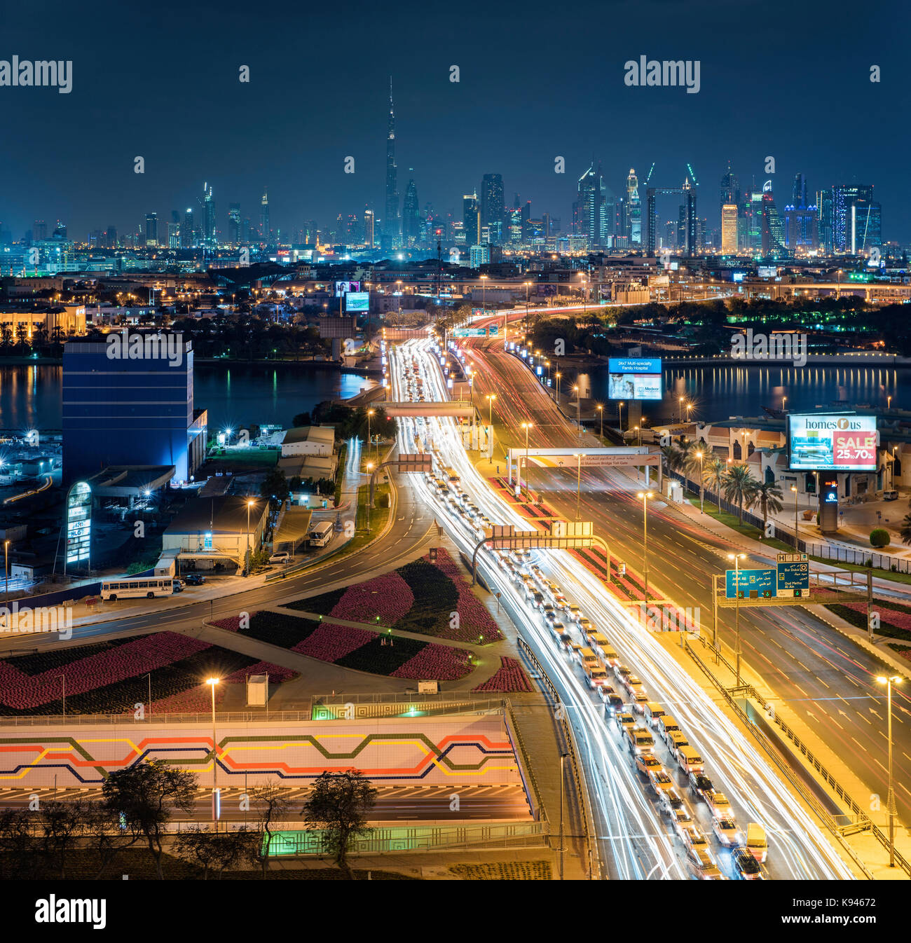 Cityscape of the Dubai, United Arab Emirates at dusk, with highway across the marina and skyscrapers in the distance. Stock Photo