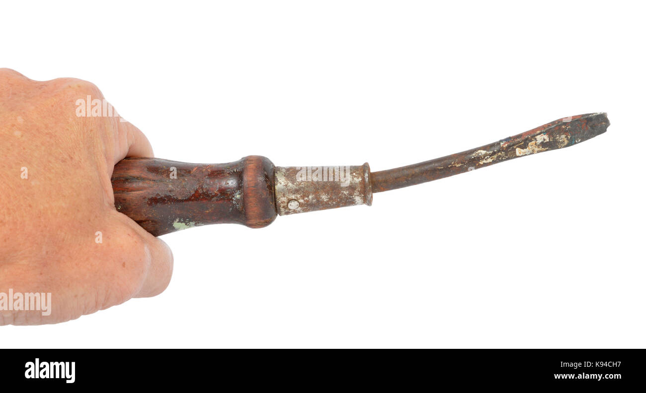 Horizontal shot of an old hand gripping an old bent screwdriver.  White background. Stock Photo